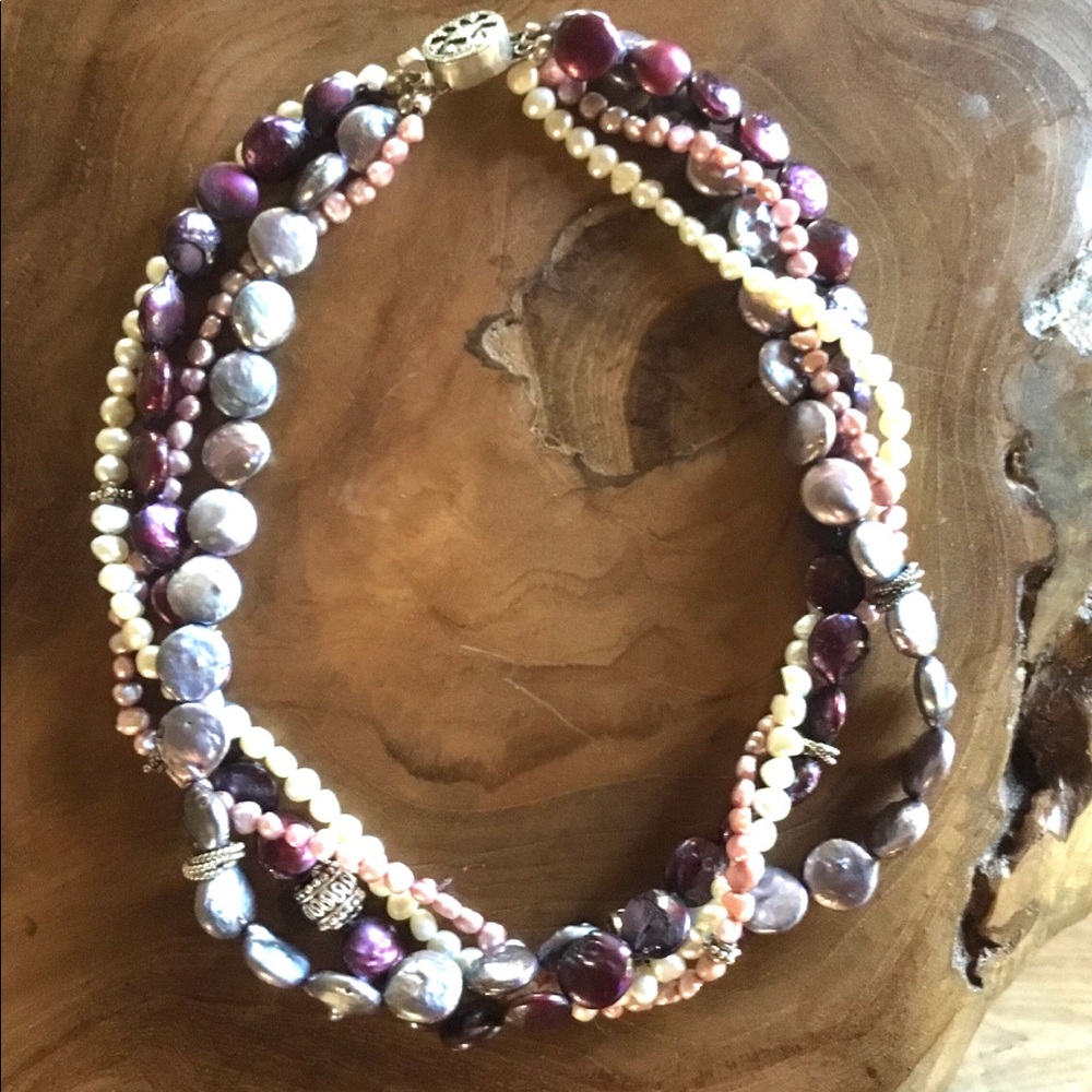 4 strands of pearls with intermixed sterling silver beads on a SS clasp